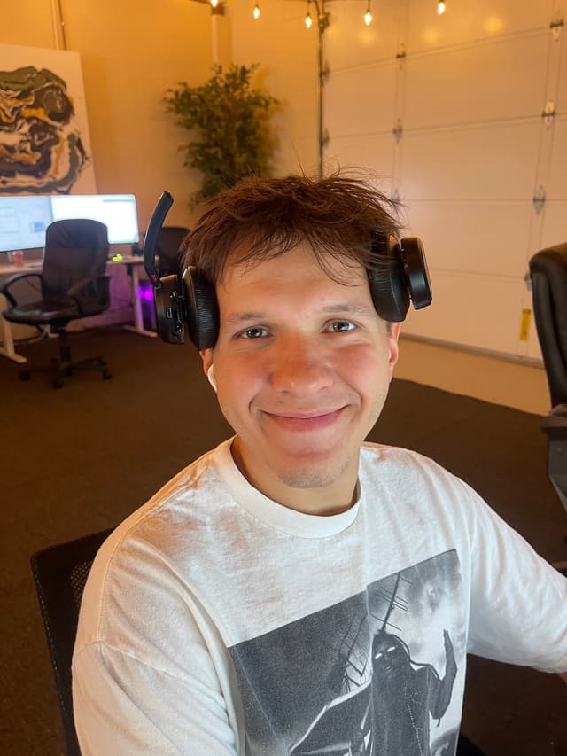 Smiling team member wearing a headset in the office